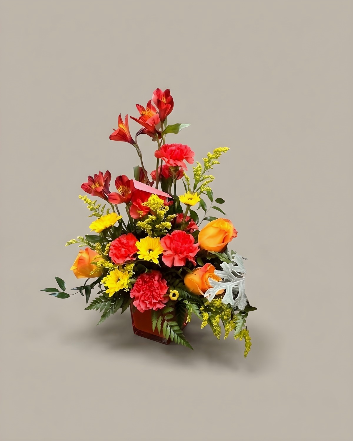 A standing spray in red, orange and white on an easel